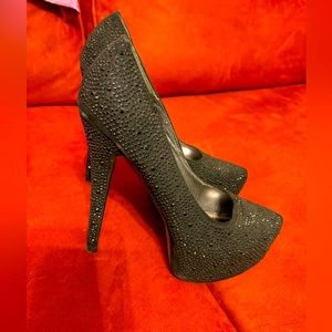 Black rhinestone pumps.